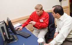 InfinityQS expert looking at SPC solutions with your quality team