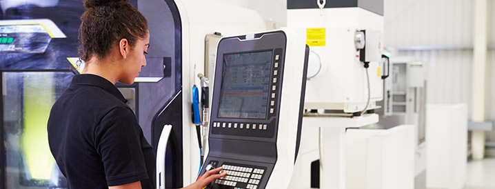 A woman easily setting up SPC data collection on a manufacturing terminal