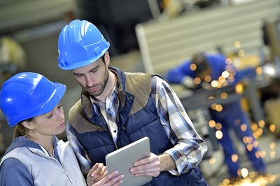 Manufacturing engineers using SOPs on shop floor